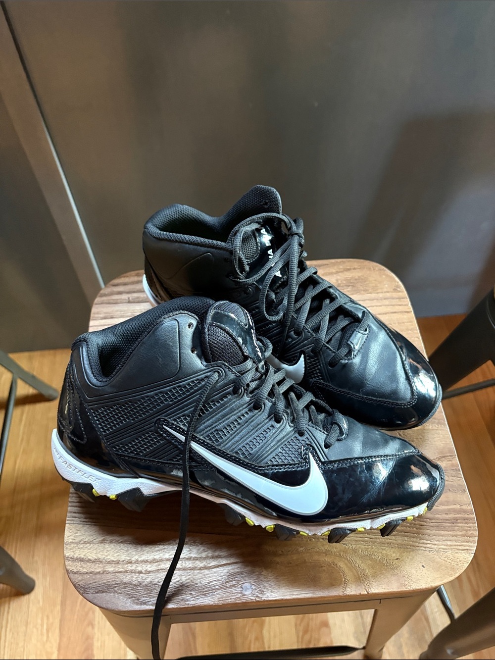 Nike Men's Black Athletic Cleats with White Swoosh